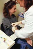 Student recieving treatment from a nurse